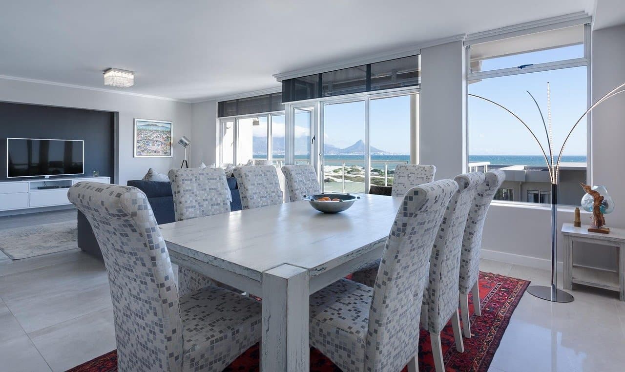 Original dining room photo before staging: the table holds only a fruit bowl, with no tabletop decor